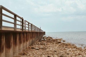 fishing pier rocks and water
