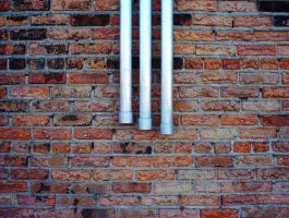3 silver pipes, building