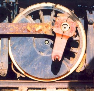 close up of steam engine wheel