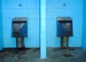 two aluminum public urinal