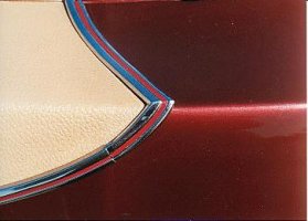 back of hood and trunk of red car